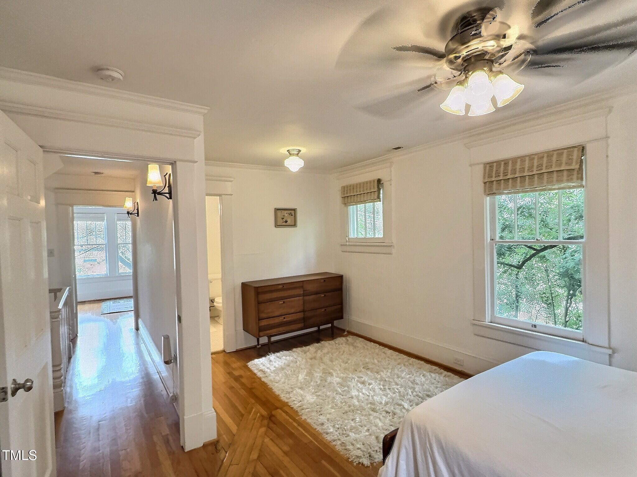 901 West Markham Avenue Durham, NC 27701 - Photo 32 of 38 a bedroom with a bed and a chandelier