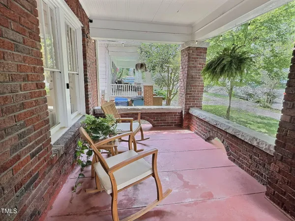 a swimming pool with outdoor seating