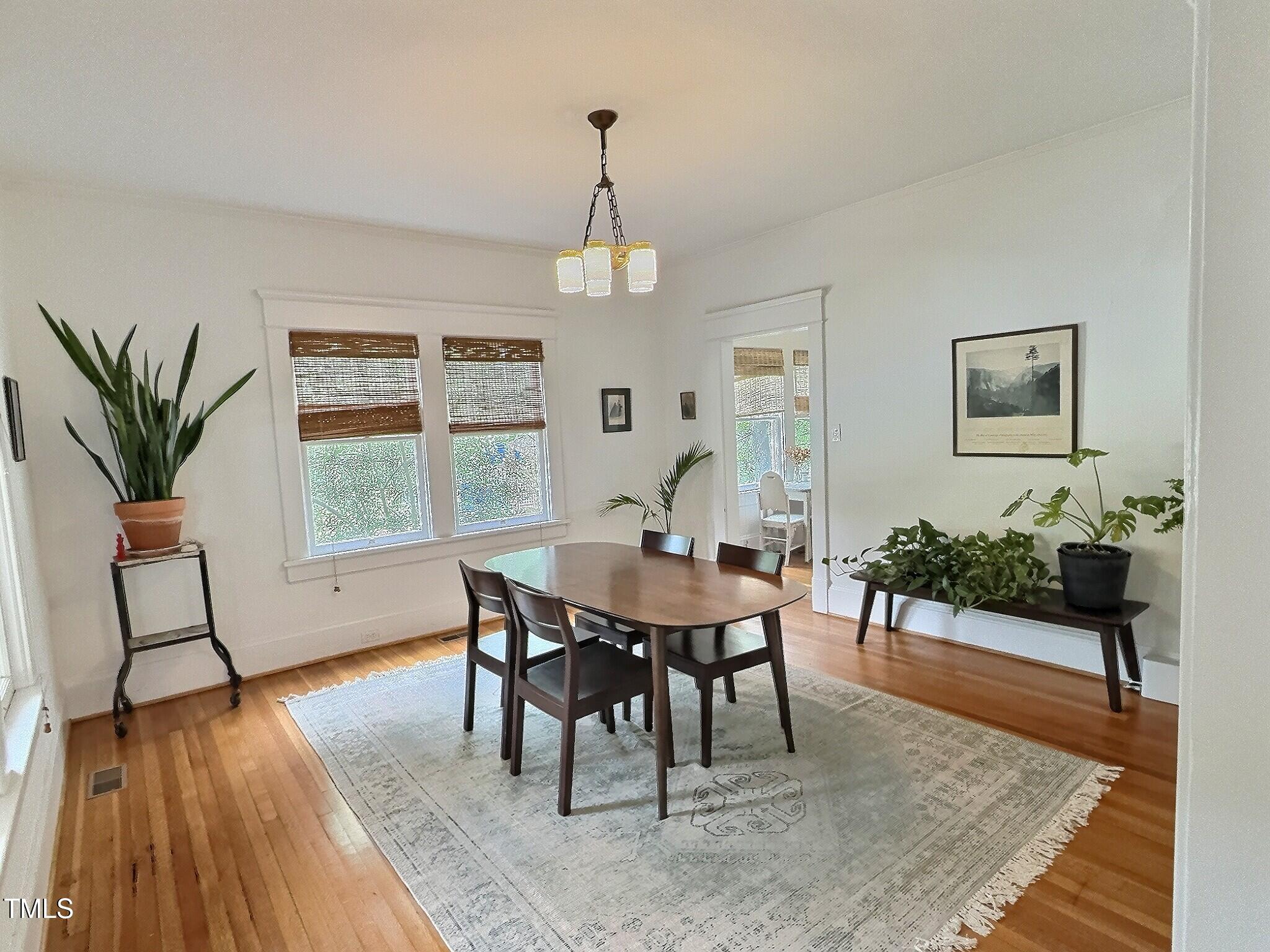 901 West Markham Avenue Durham, NC 27701 - Photo 9 of 38 a view of a dining room with furniture window and wooden floor