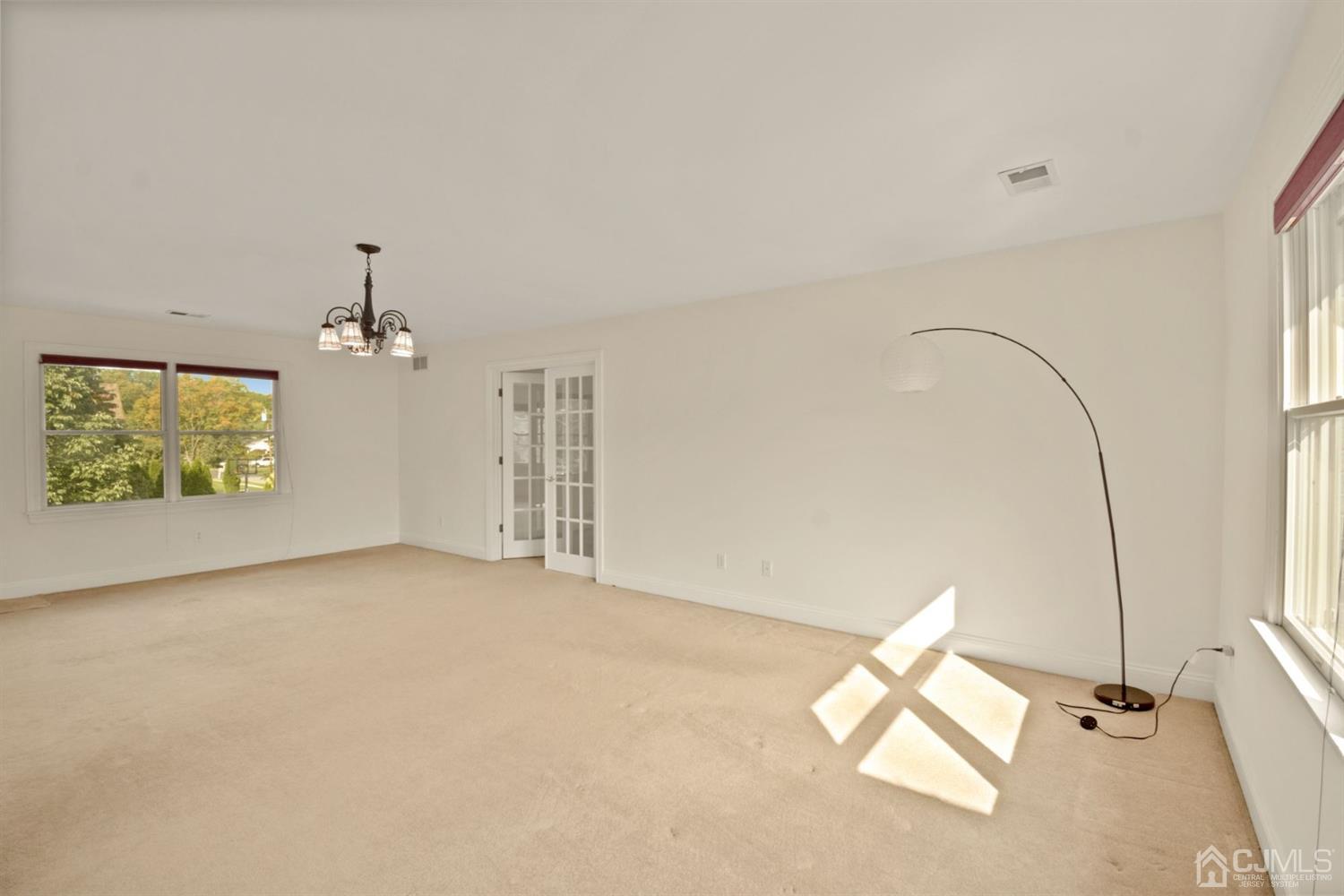 734 New Dover Road Edison, NJ 08820 - Photo 22 of 61 wooden floor in an empty room with a window