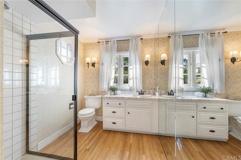 806 Adlena Drive Fullerton, CA 92833 - Photo 17 of 37 a spacious bathroom with a double vanity sink a large mirror a bathtub and shower