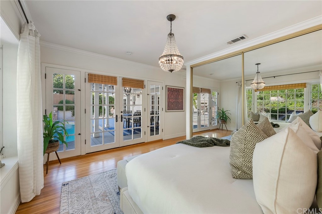 806 Adlena Drive Fullerton, CA 92833 - Photo 21 of 37 a spacious bedroom with a large bed and a chandelier