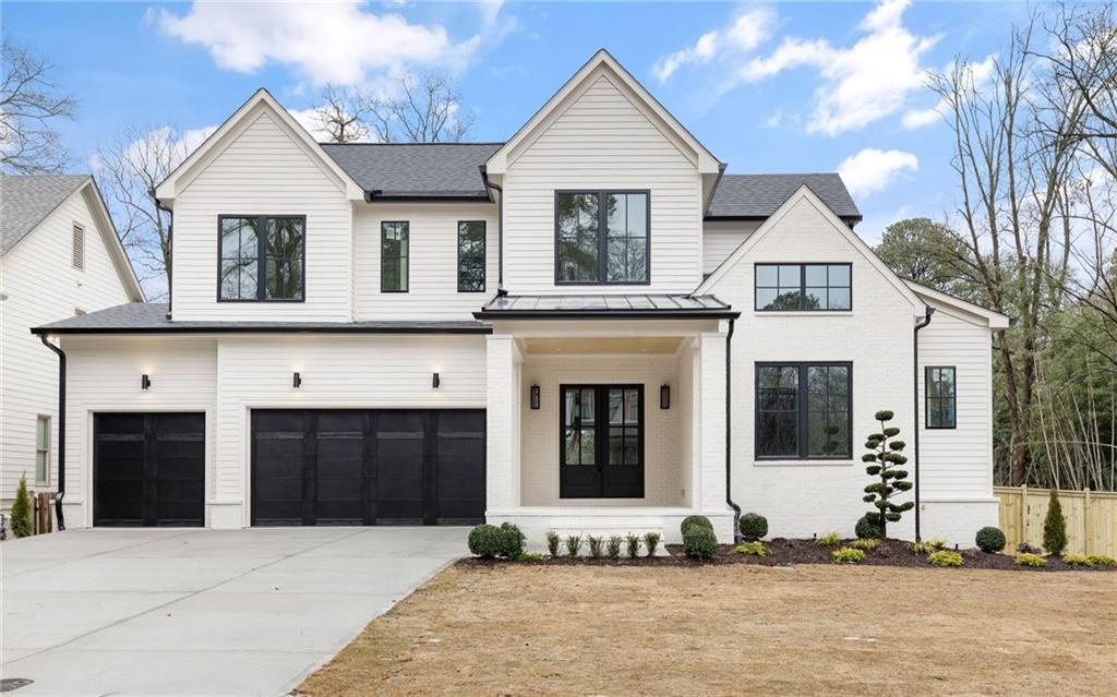 1396 Sylvan Circle Northeast Brookhaven, GA 30319 - Photo 1 of 1 a front view of a house with a yard