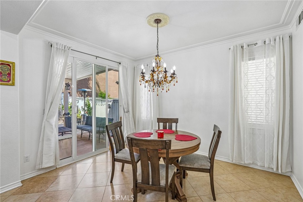 46101 Sharon Street Temecula, CA 92592 - Photo 12 of 34 a view of a dining room with furniture window and outside view