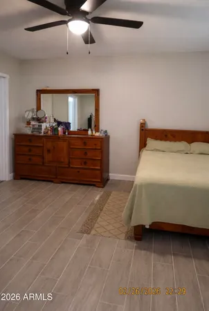 a bed room with a bed and a dresser