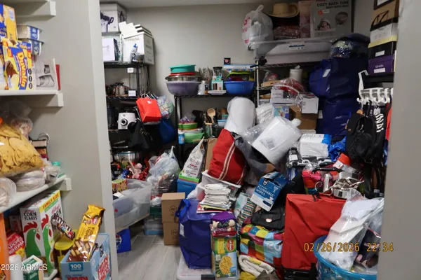 a room with lots of furniture and clutter