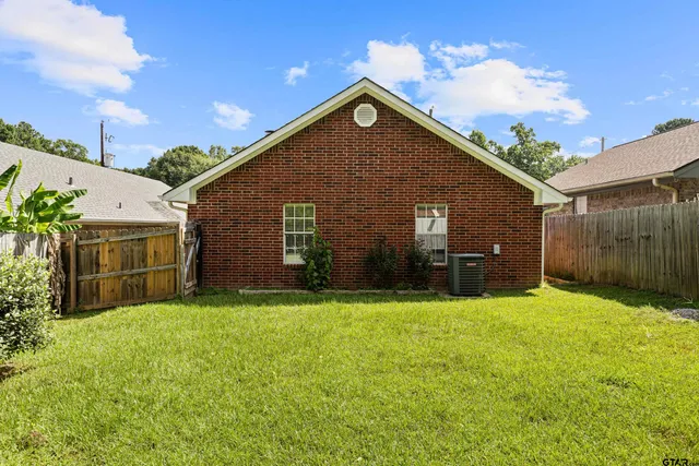 a aerial view of a house with a yard