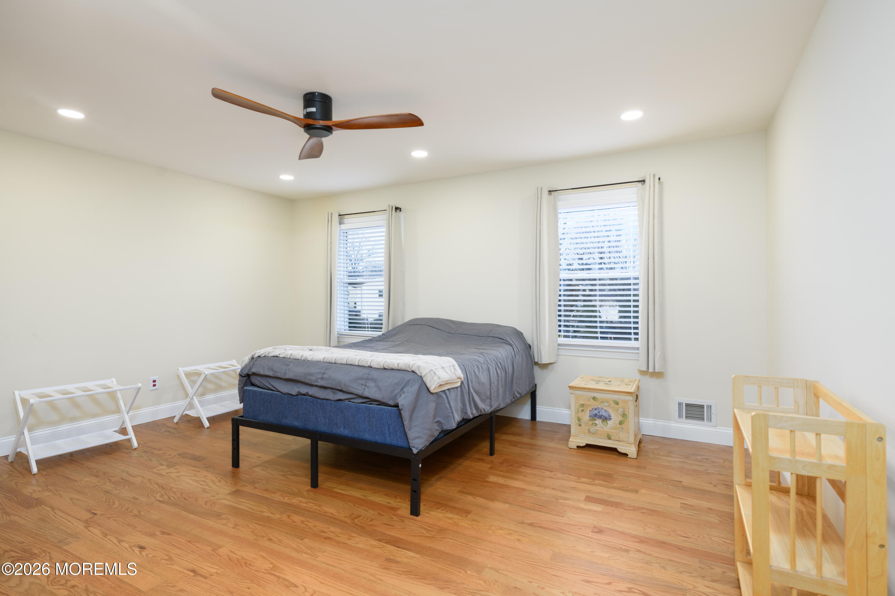 4 Colgate Court Hazlet, NJ 07730 - Photo 24 of 43 a bedroom with a bed and a table in it