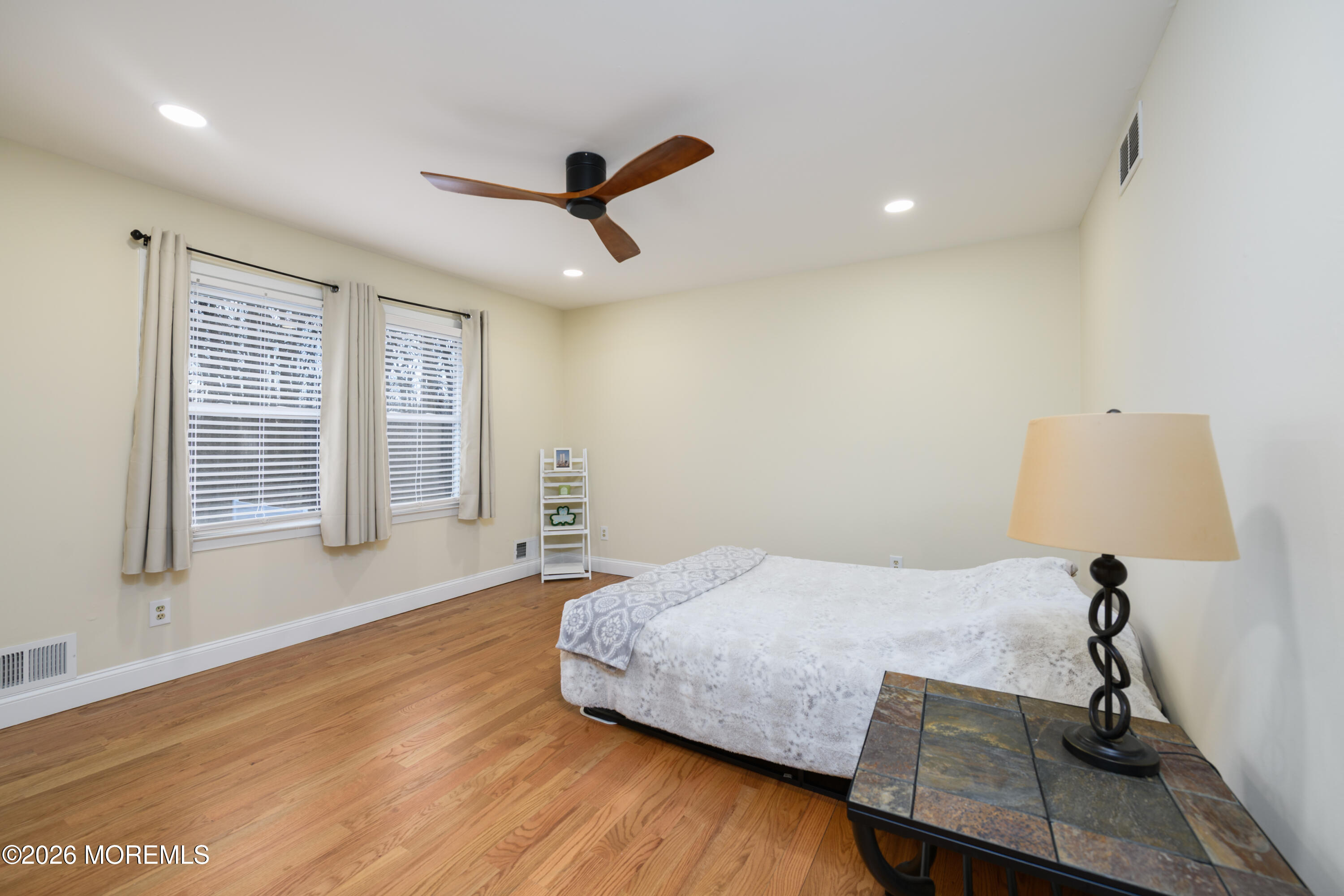4 Colgate Court Hazlet, NJ 07730 - Photo 25 of 43 a bedroom with a bed and wooden floor