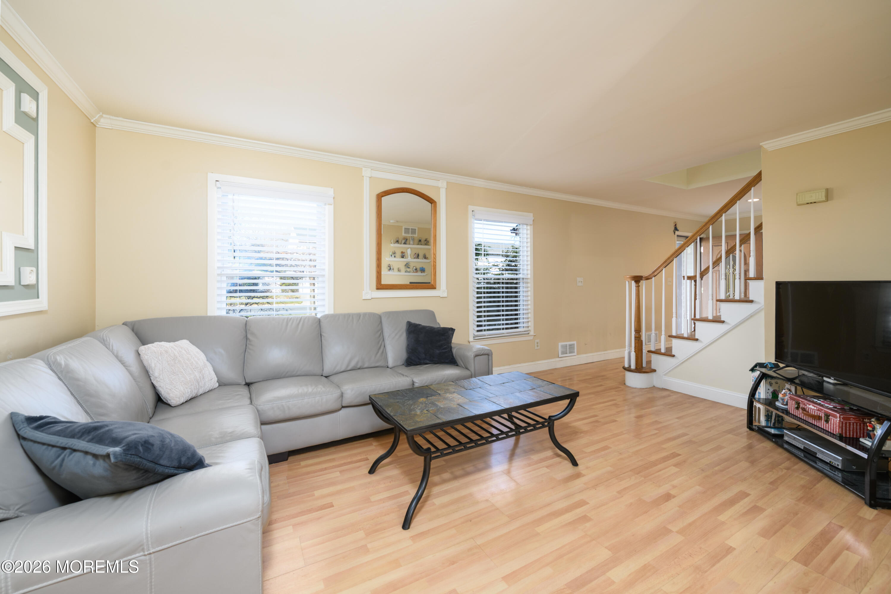 4 Colgate Court Hazlet, NJ 07730 - Photo 4 of 43 a living room with furniture and a flat screen tv