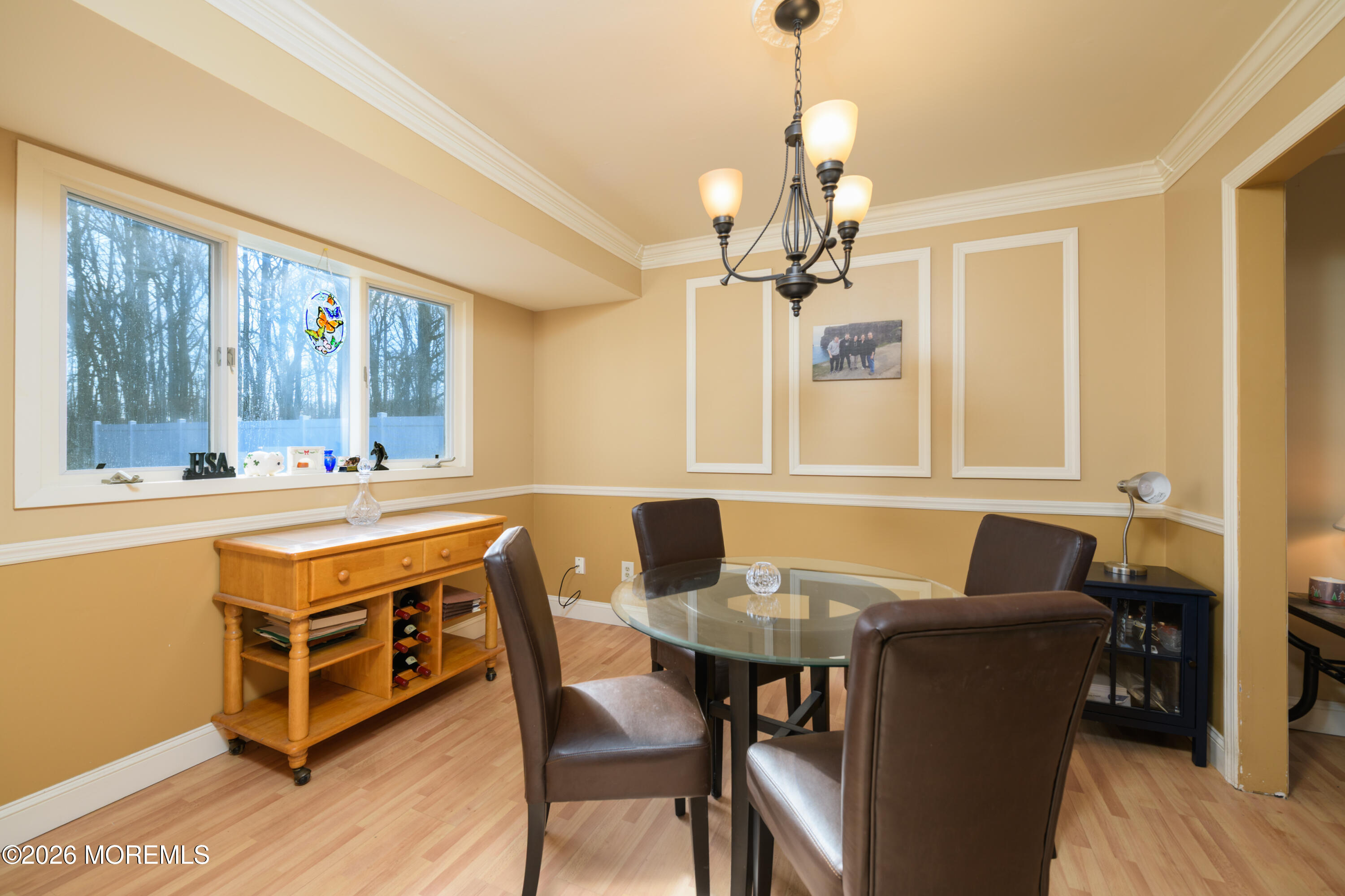 4 Colgate Court Hazlet, NJ 07730 - Photo 7 of 43 a dining room with a table chairs and a dining table with wooden floor
