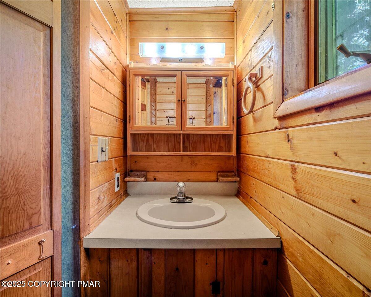115 Dirk Road Tafton, PA 18464 - Photo 16 of 24 a bathroom with a sink and a mirror