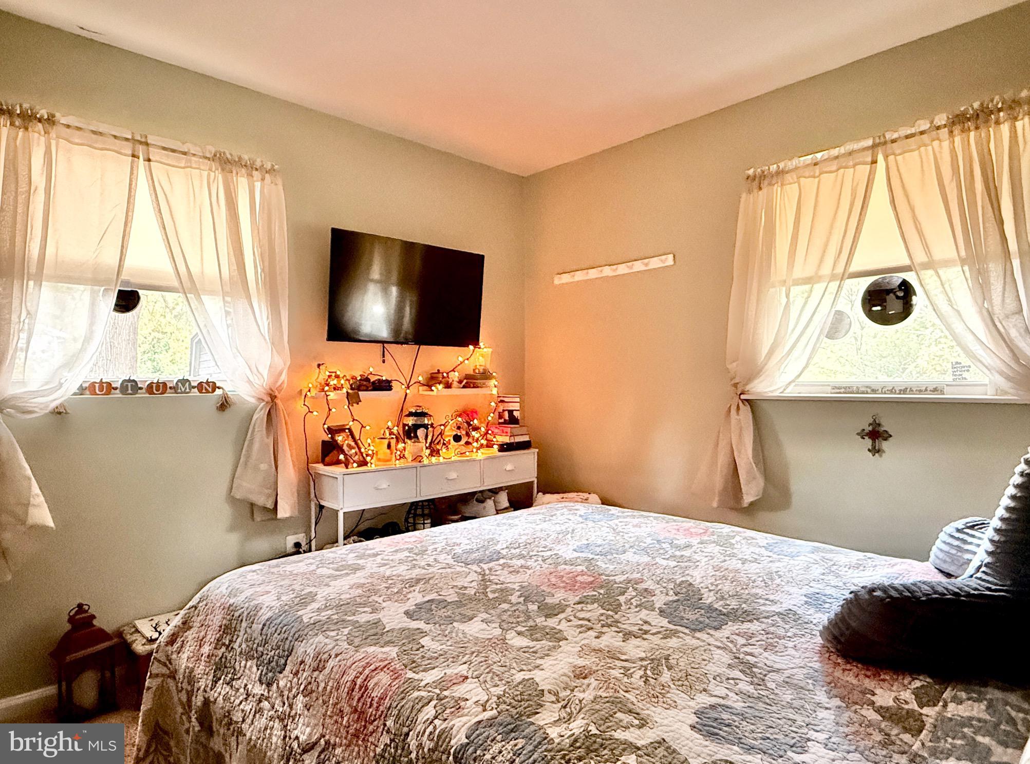 1325 Janvier Road Williamstown, NJ 08094 - Photo 16 of 32 a bedroom with a bed and a flat tv screen on the dresser