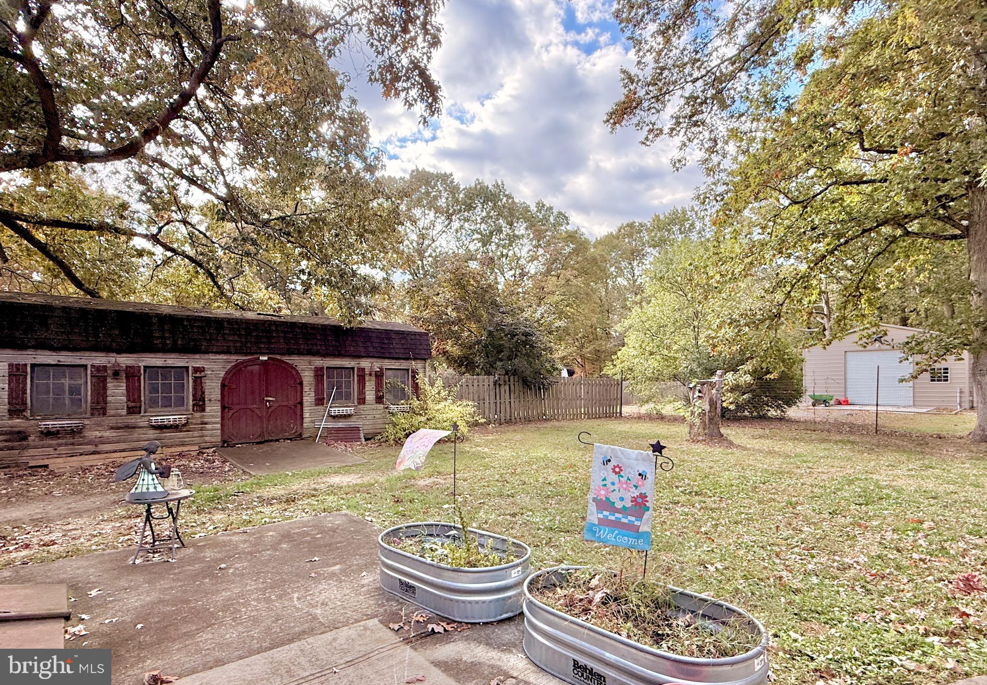 1325 Janvier Road Williamstown, NJ 08094 - Photo 31 of 32 a backyard of a house with barbeque oven fire pit table and chairs