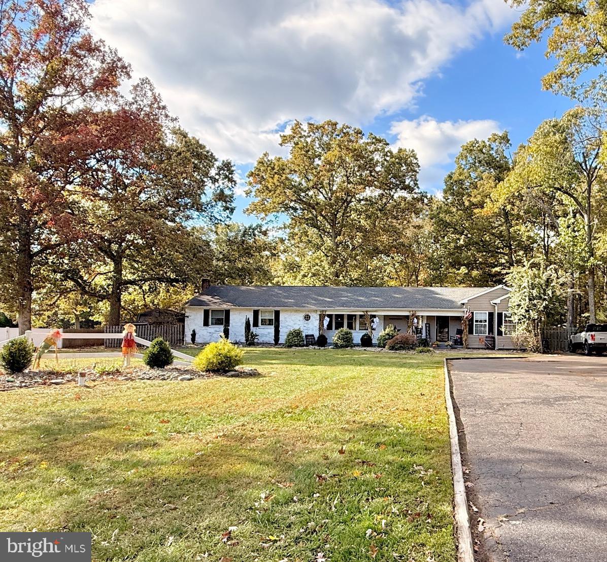 1325 Janvier Road Williamstown, NJ 08094 - Photo 32 of 32 a view of swimming pool with outdoor seating and trees in the background