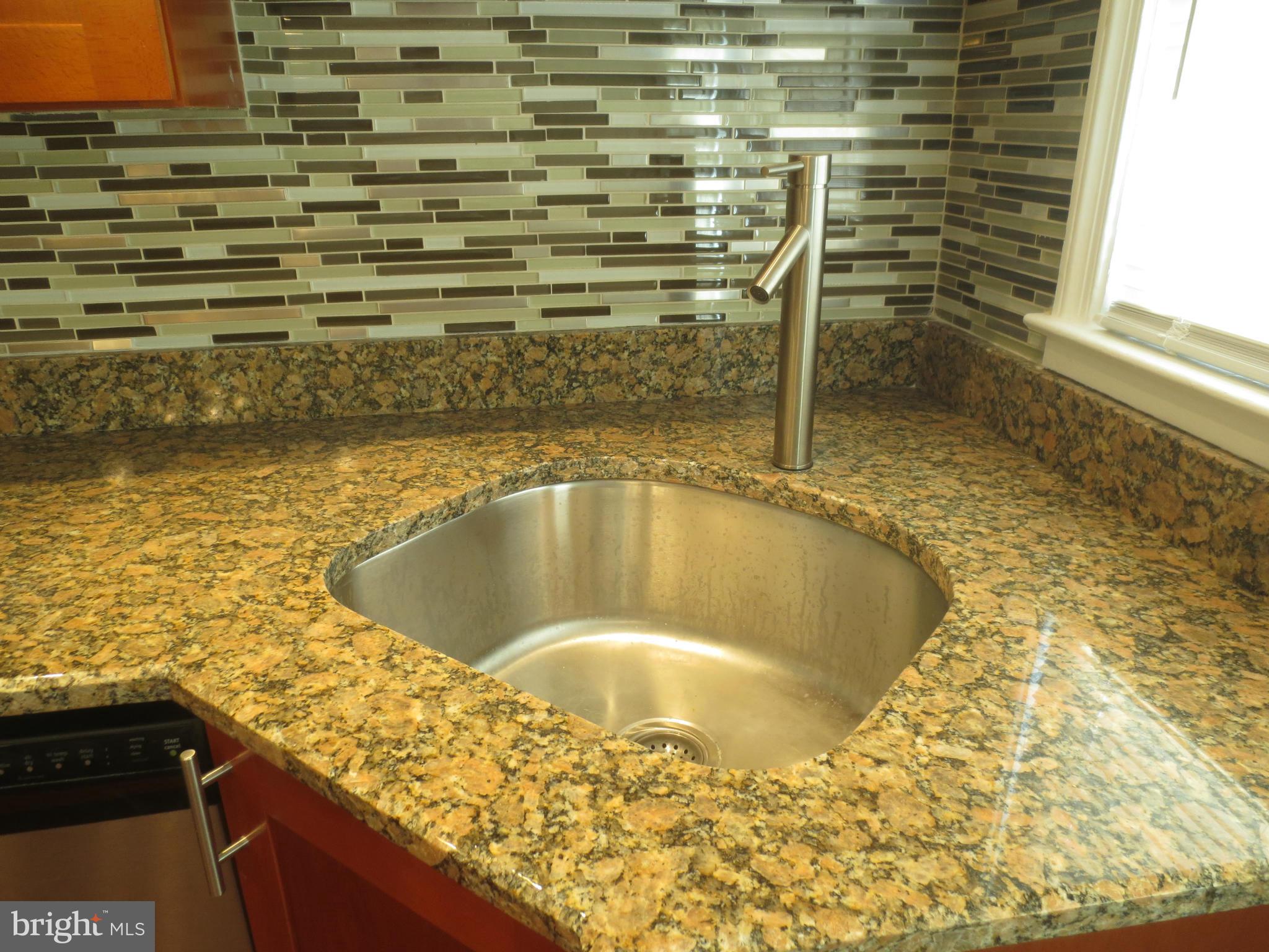 1503 Gleneagle Road Baltimore, MD 21239 - Photo 15 of 26 Granite Counters and Custom Backsplash