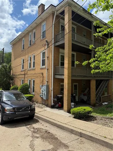 a front view of a house with a swimming pool