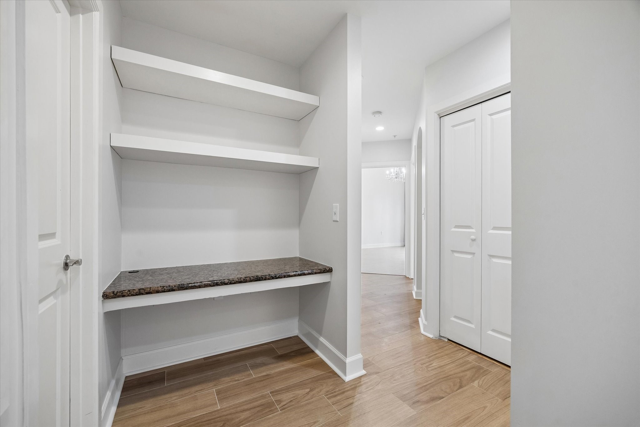 100 Willard Street, Unit 15 Houston, TX 77006 - Photo 11 of 25 Built-in desk and shelving area provide the perfect work from home space, study nook, or additional storage area.