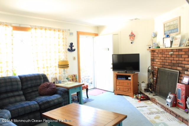 46 Cedar Run Road Bayville, NJ 08721 - Photo 4 of 16 a living room with furniture and a flat screen tv