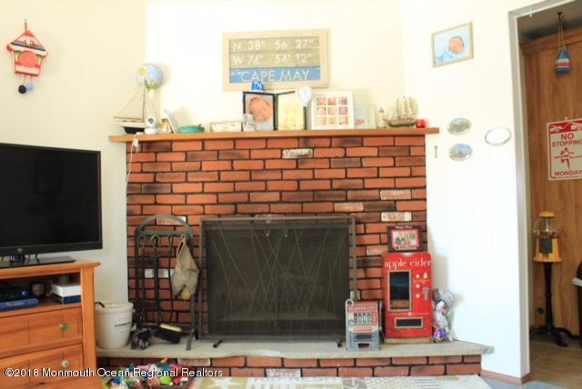 46 Cedar Run Road Bayville, NJ 08721 - Photo 5 of 16 a picture of a living room with a fireplace