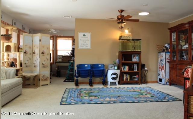 46 Cedar Run Road Bayville, NJ 08721 - Photo 8 of 16 a living room with furniture and a rug