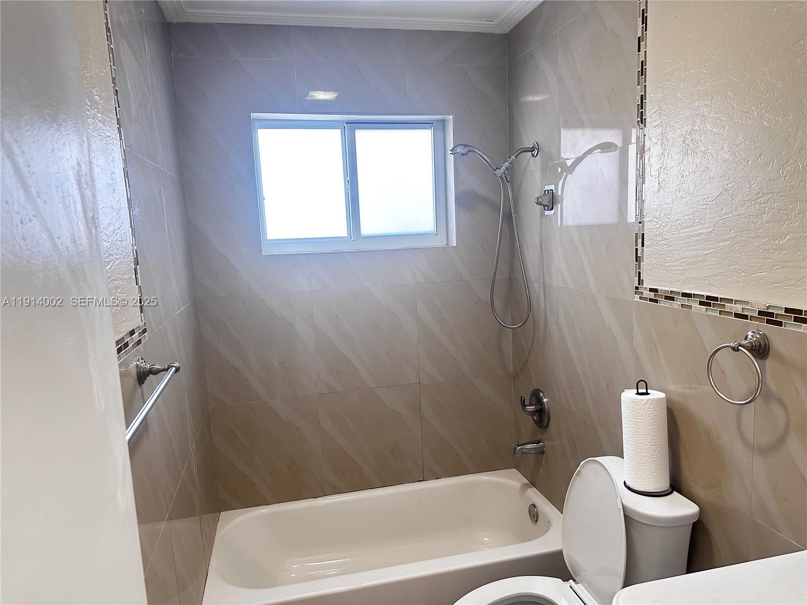 2914 Southwest 92nd Court Miami, FL 33165 - Photo 15 of 37 a bathroom with a toilet and bathtub