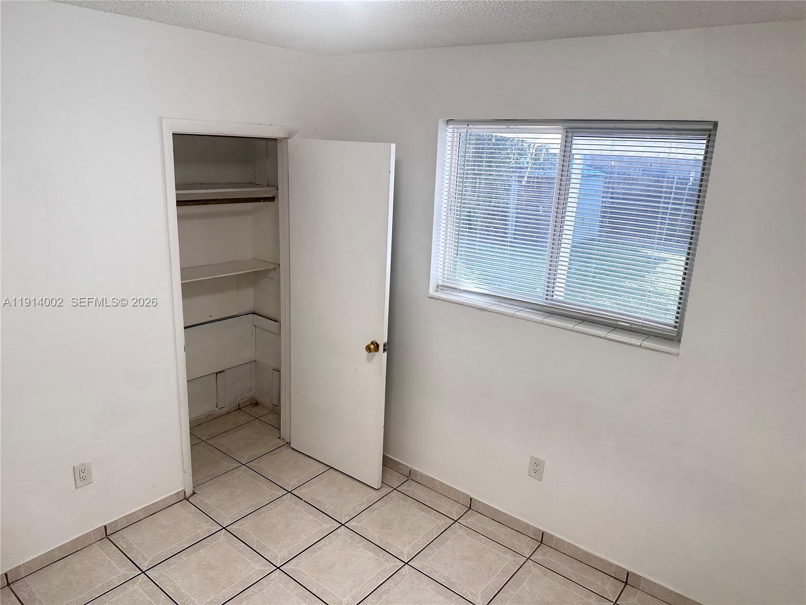 2914 Southwest 92nd Court Miami, FL 33165 - Photo 18 of 39 a view of an empty room with a window