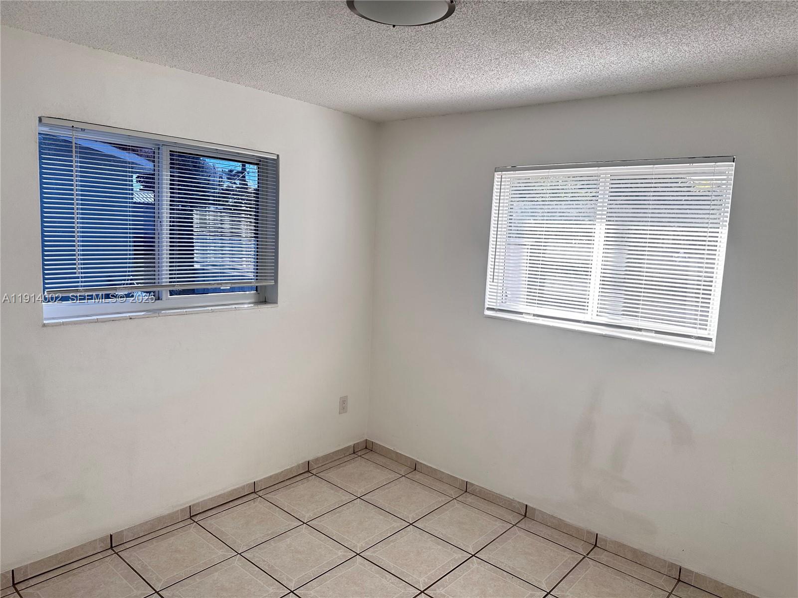 2914 Southwest 92nd Court Miami, FL 33165 - Photo 26 of 37 a view of an empty room with a window