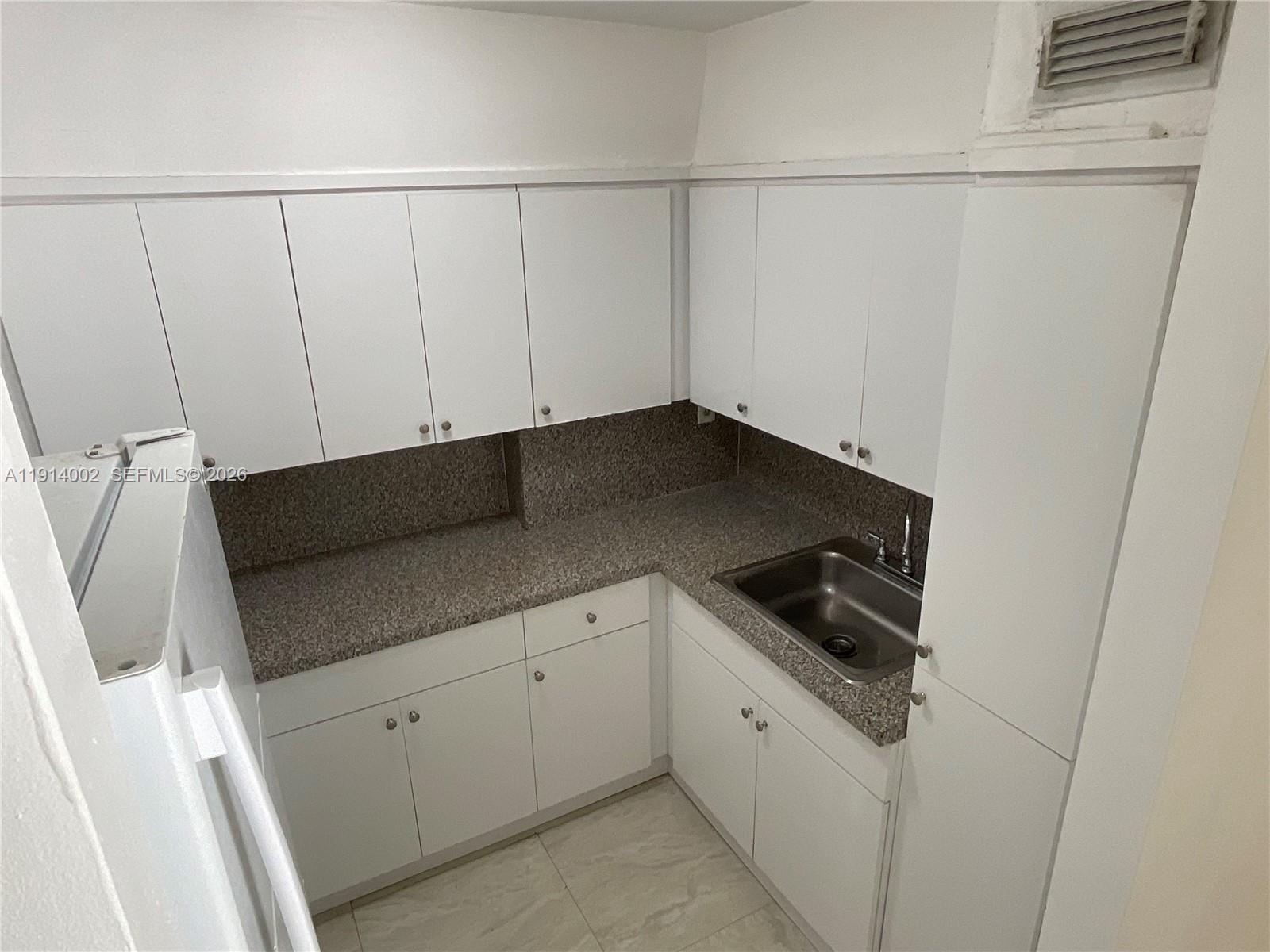 2914 Southwest 92nd Court Miami, FL 33165 - Photo 28 of 39 a view of a utility room with cabinets