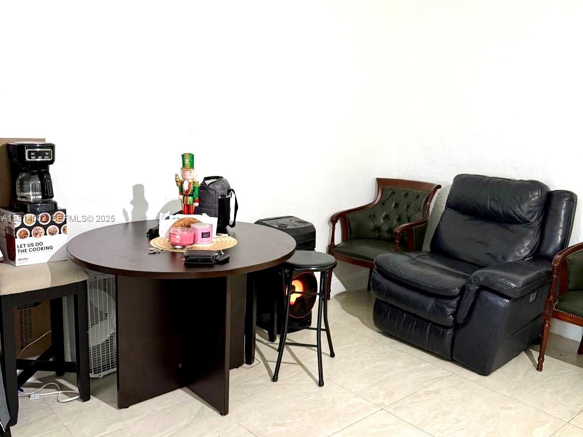 2914 Southwest 92nd Court Miami, FL 33165 - Photo 28 of 37 a living room with furniture and a dining table