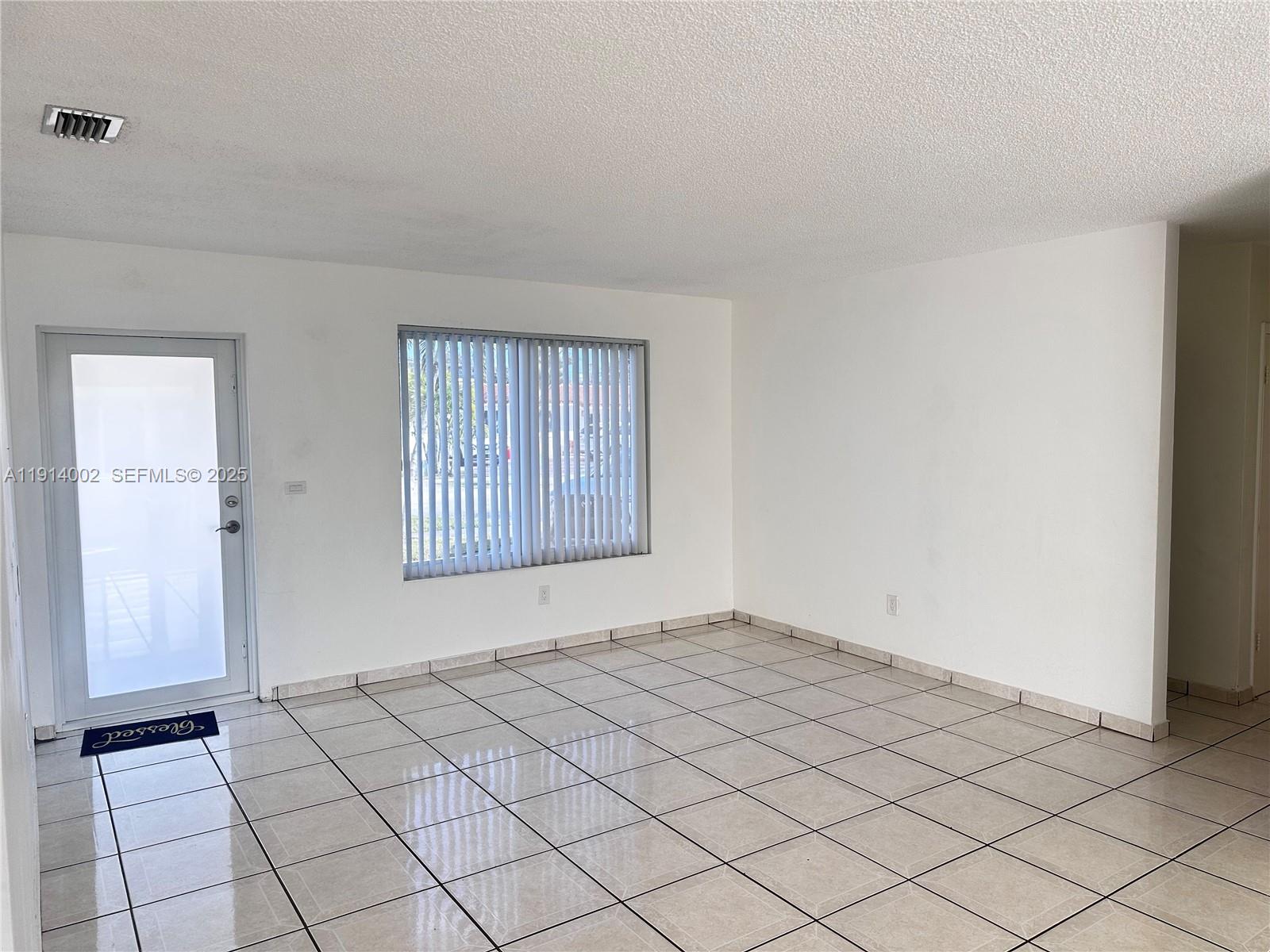 2914 Southwest 92nd Court Miami, FL 33165 - Photo 3 of 37 a view of an empty room and window