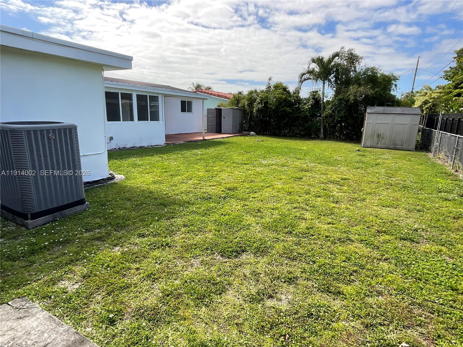 2914 Southwest 92nd Court Miami, FL 33165 - Photo 36 of 39 a view of a house with a yard