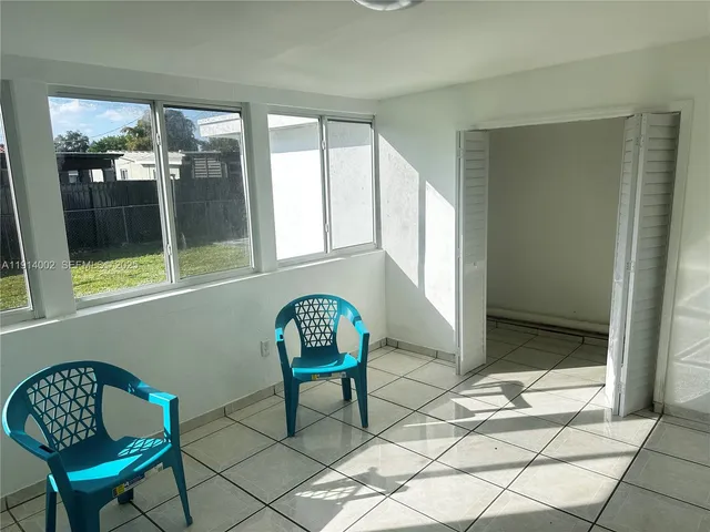 a kitchen with a sink and a refrigerator