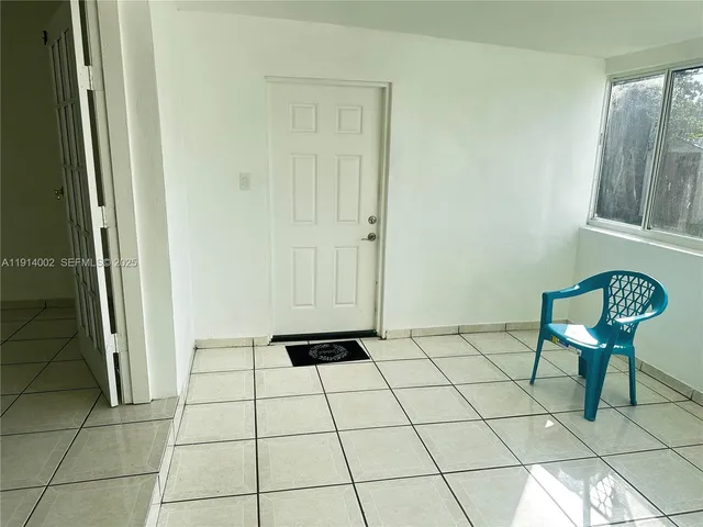 a bathroom with a toilet and a mirror