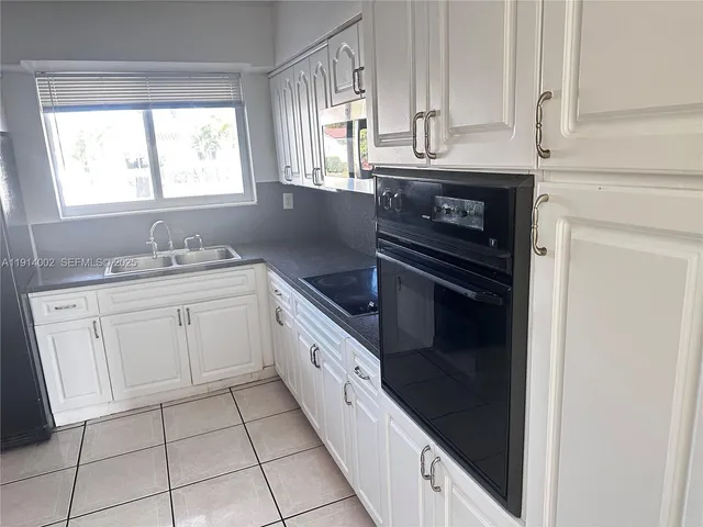 a bathroom with a toilet and bathtub