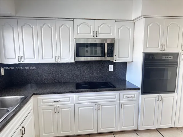 a view of an empty room with windows