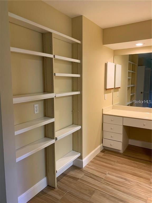 3090 Sunset Point Road Clearwater, FL 33759 - Photo 14 of 16 a view of walk in closet with empty racks