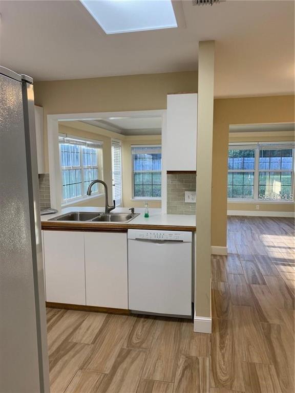 3090 Sunset Point Road Clearwater, FL 33759 - Photo 8 of 16 a bathroom with a sink and a mirror