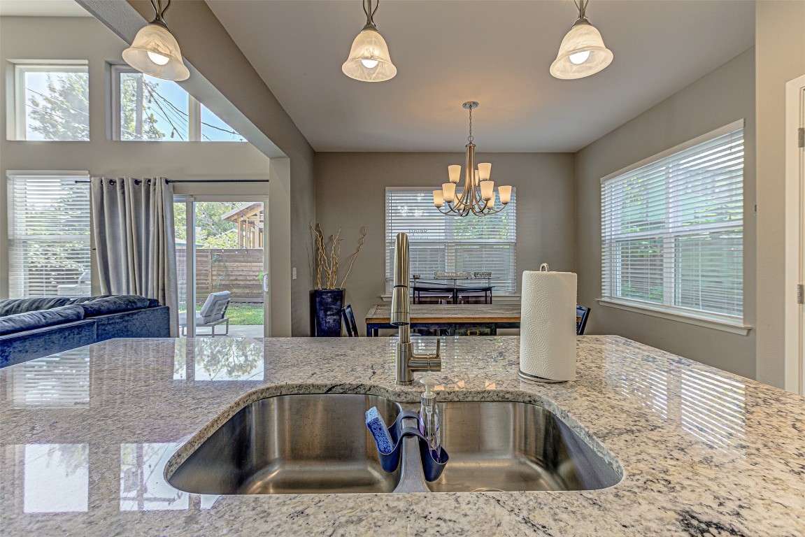 4809 Bolm Road Austin, TX 78702 - Photo 15 of 29 a kitchen with a sink and a granite counter top