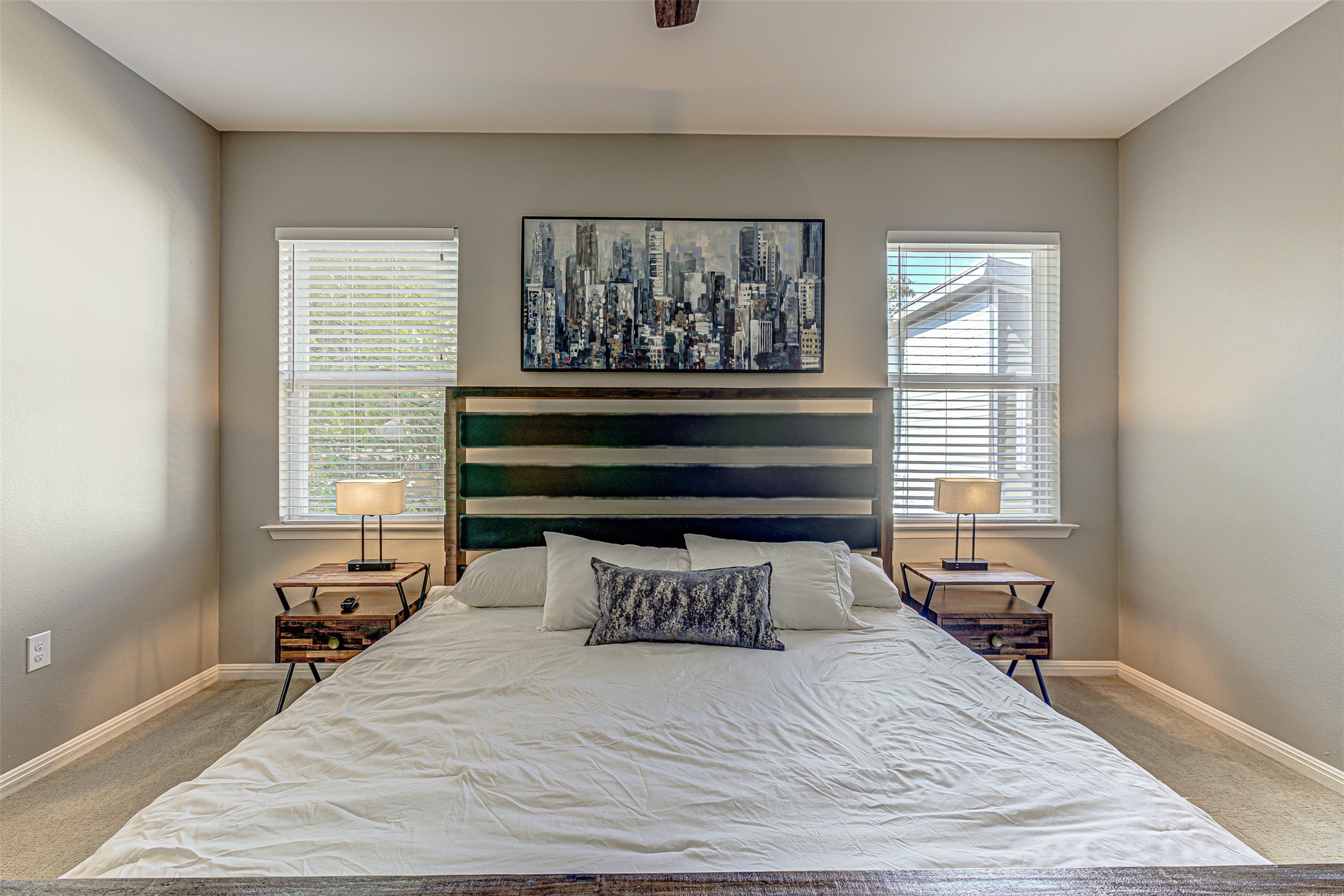 4809 Bolm Road Austin, TX 78702 - Photo 22 of 29 a bedroom with a bed and wooden floor