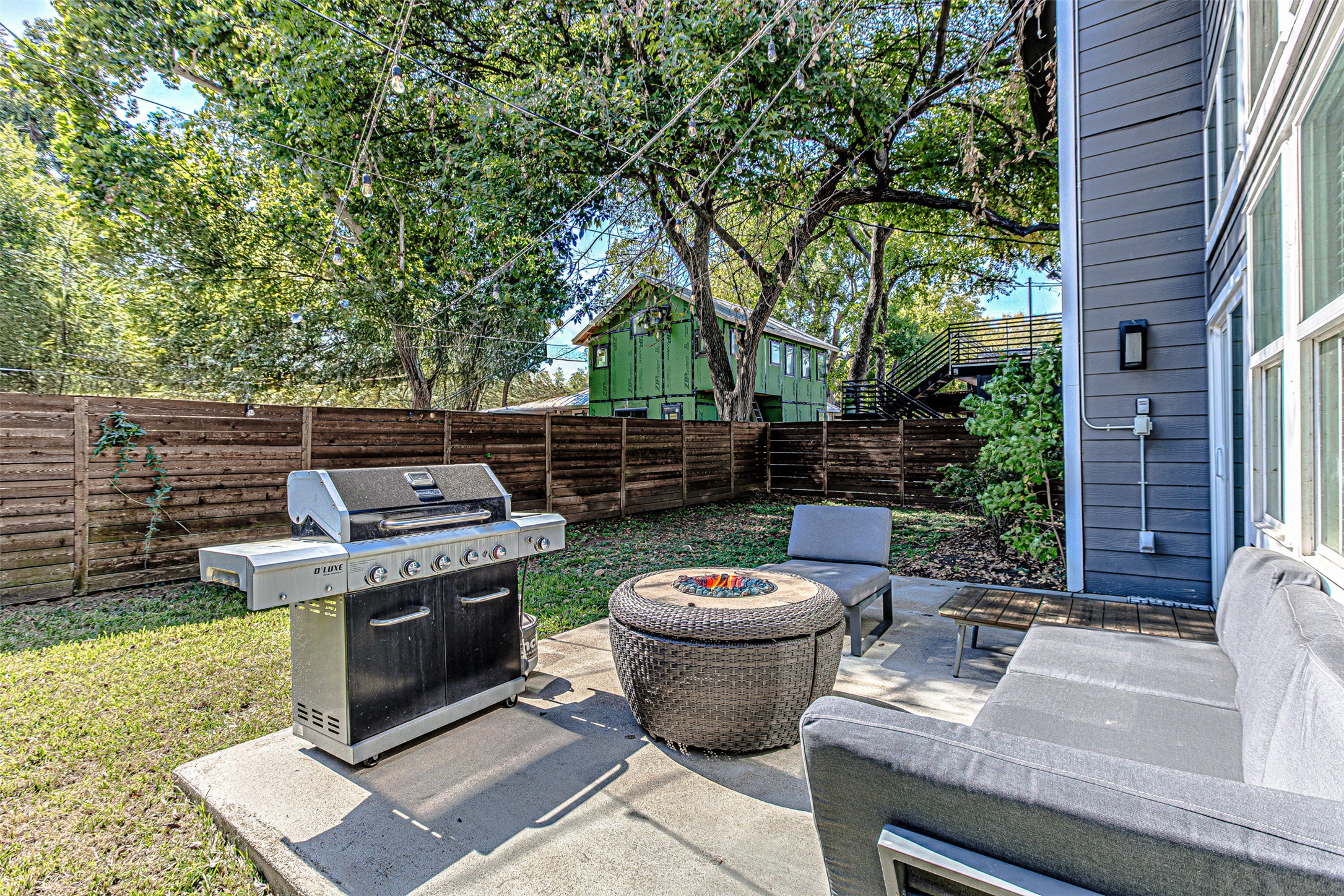 4809 Bolm Road Austin, TX 78702 - Photo 27 of 29 a view of a backyard with table and chairs and a fire pit