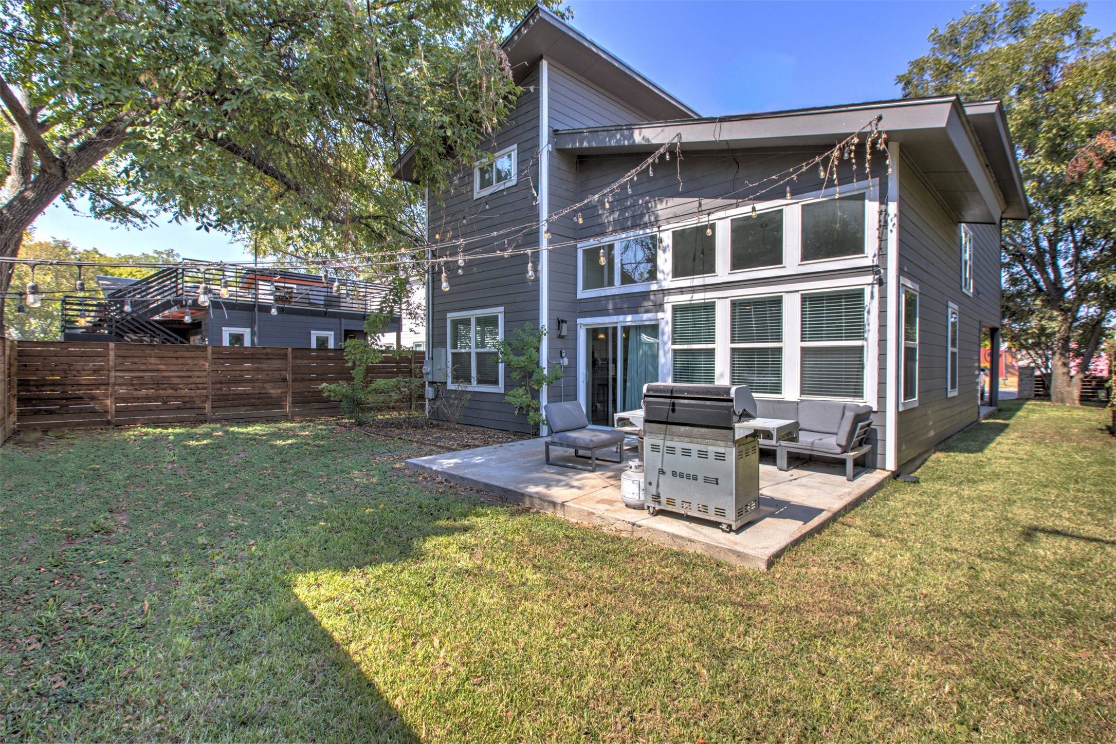 4809 Bolm Road Austin, TX 78702 - Photo 28 of 29 a view of a house with backyard porch and sitting area