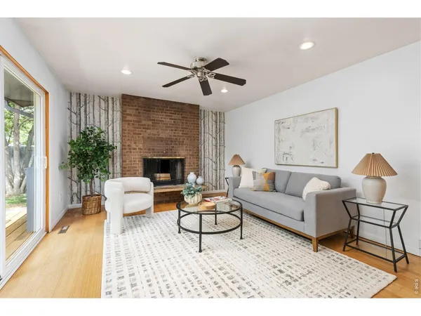 a living room with furniture and a fireplace