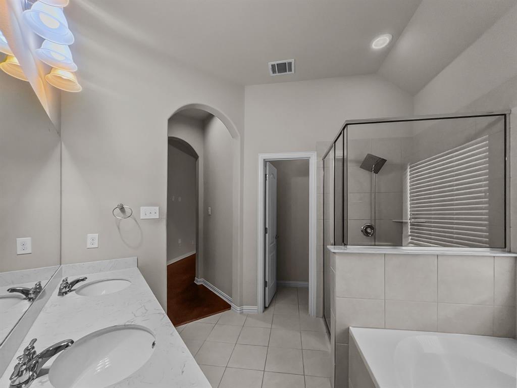 3205 Ridgeway Drive McKinney, TX 75071 - Photo 8 of 27 a bathroom with a tub sink and mirror