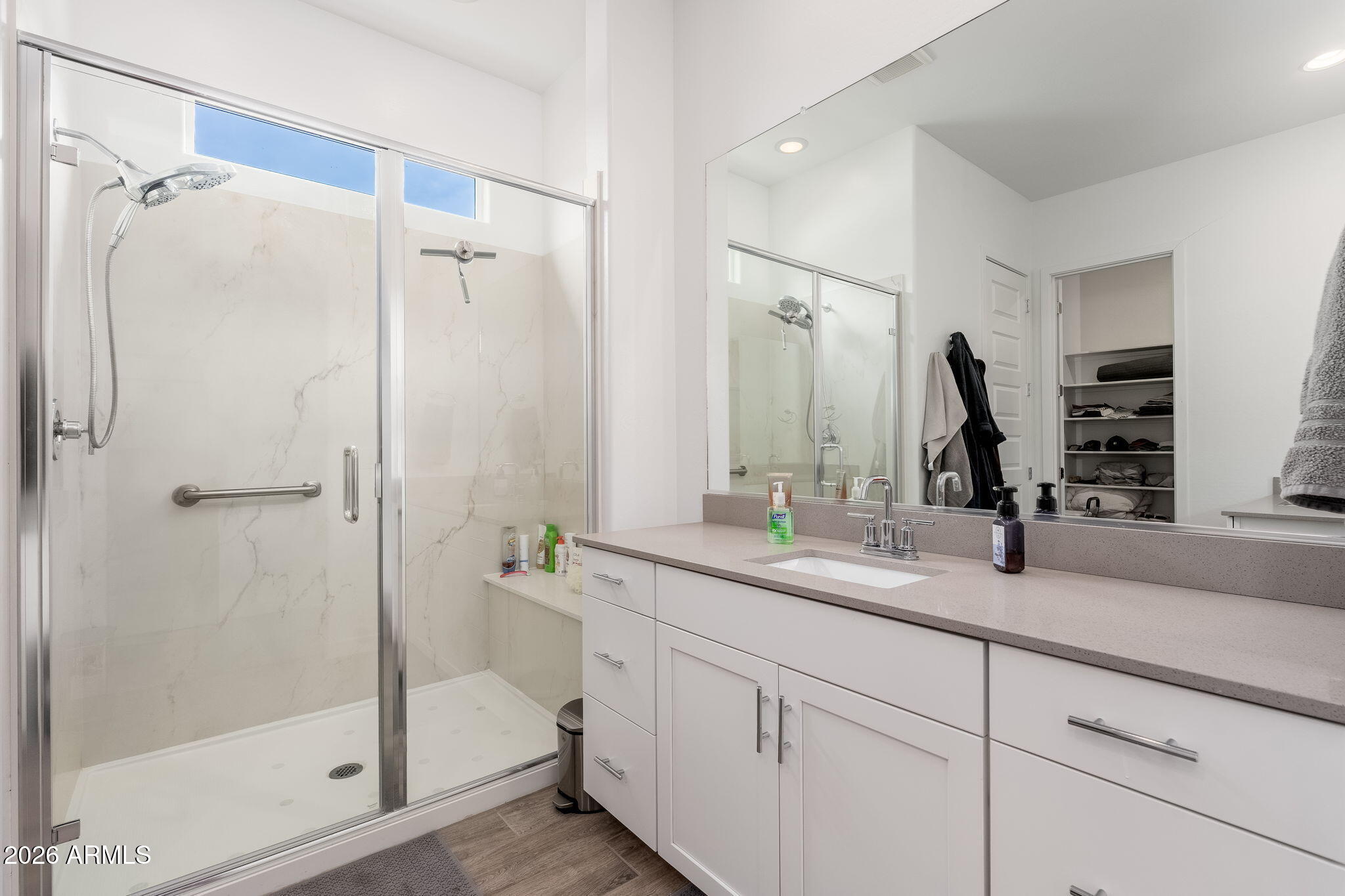 3272 West Peak View Road Phoenix, AZ 85083 - Photo 13 of 47 a bathroom with a shower sink and mirror