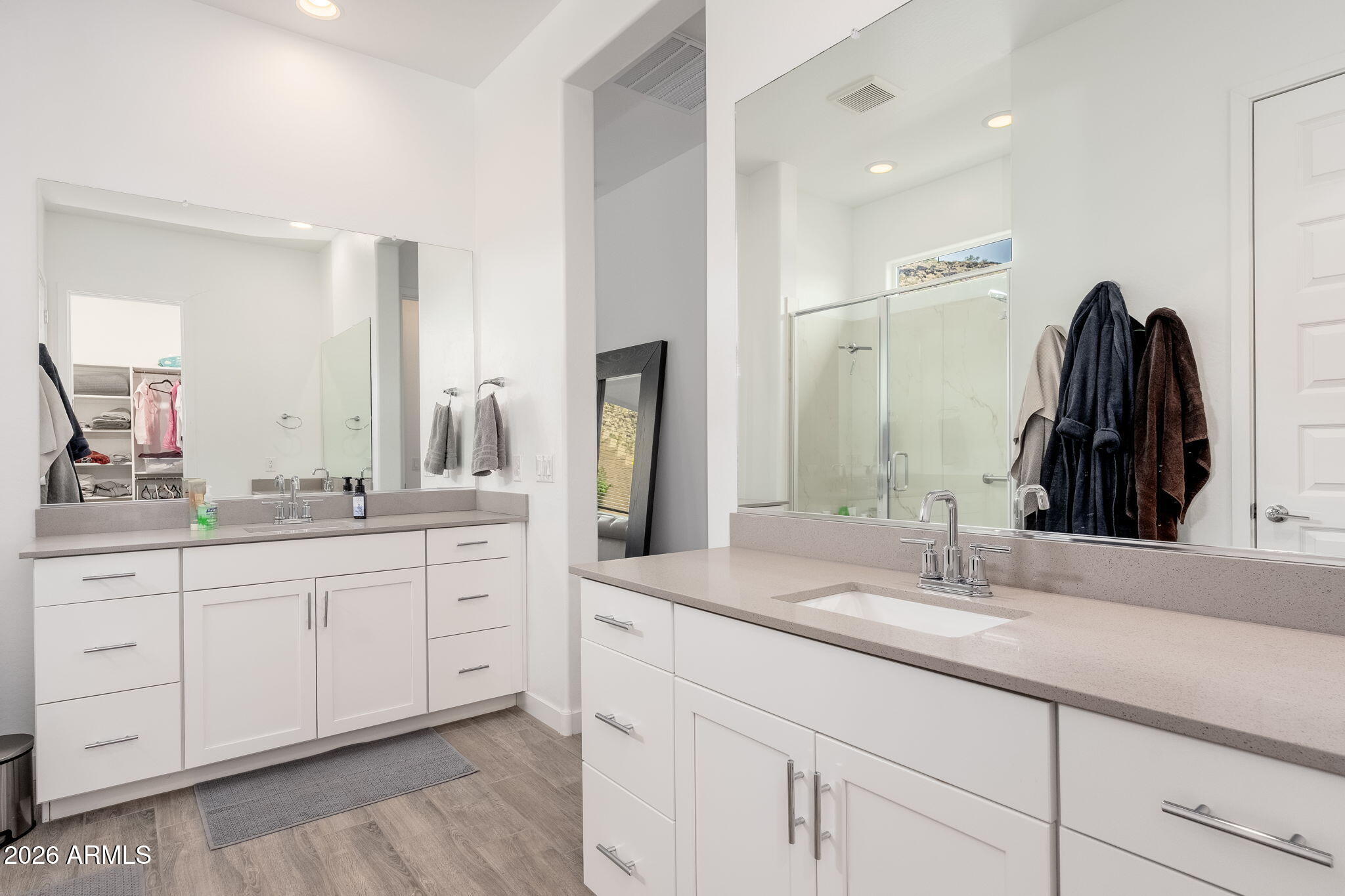3272 West Peak View Road Phoenix, AZ 85083 - Photo 14 of 47 a bathroom with a double vanity sink and a mirror