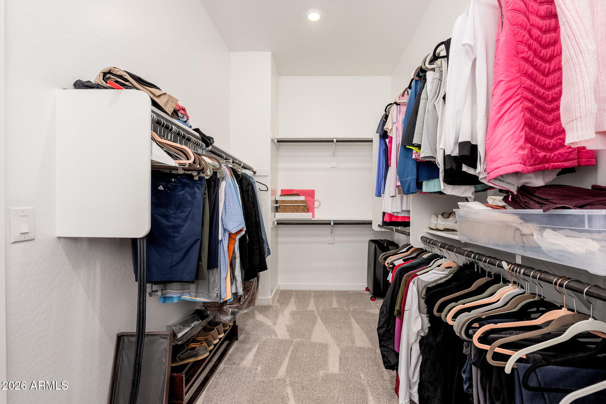 3272 West Peak View Road Phoenix, AZ 85083 - Photo 15 of 47 a view of walk in closet with clothes and shoes