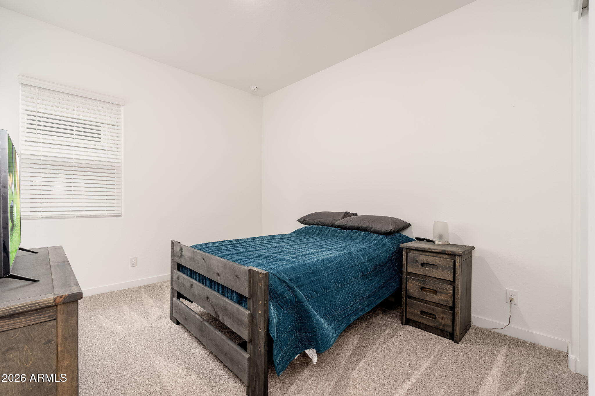 3272 West Peak View Road Phoenix, AZ 85083 - Photo 16 of 47 a bedroom with a bed and a dresser