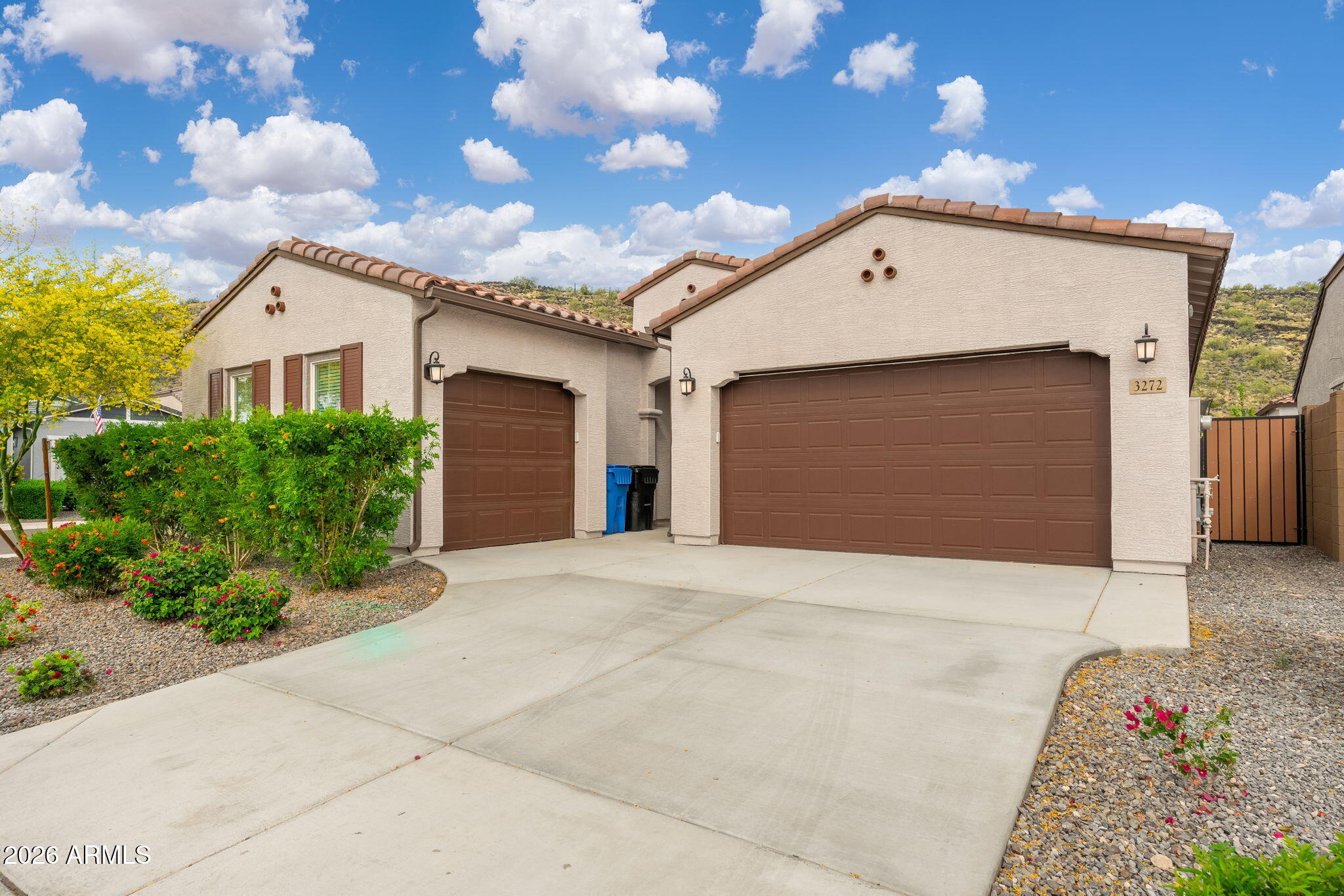 3272 West Peak View Road Phoenix, AZ 85083 - Photo 2 of 47 a front view of a house with a yard and garage