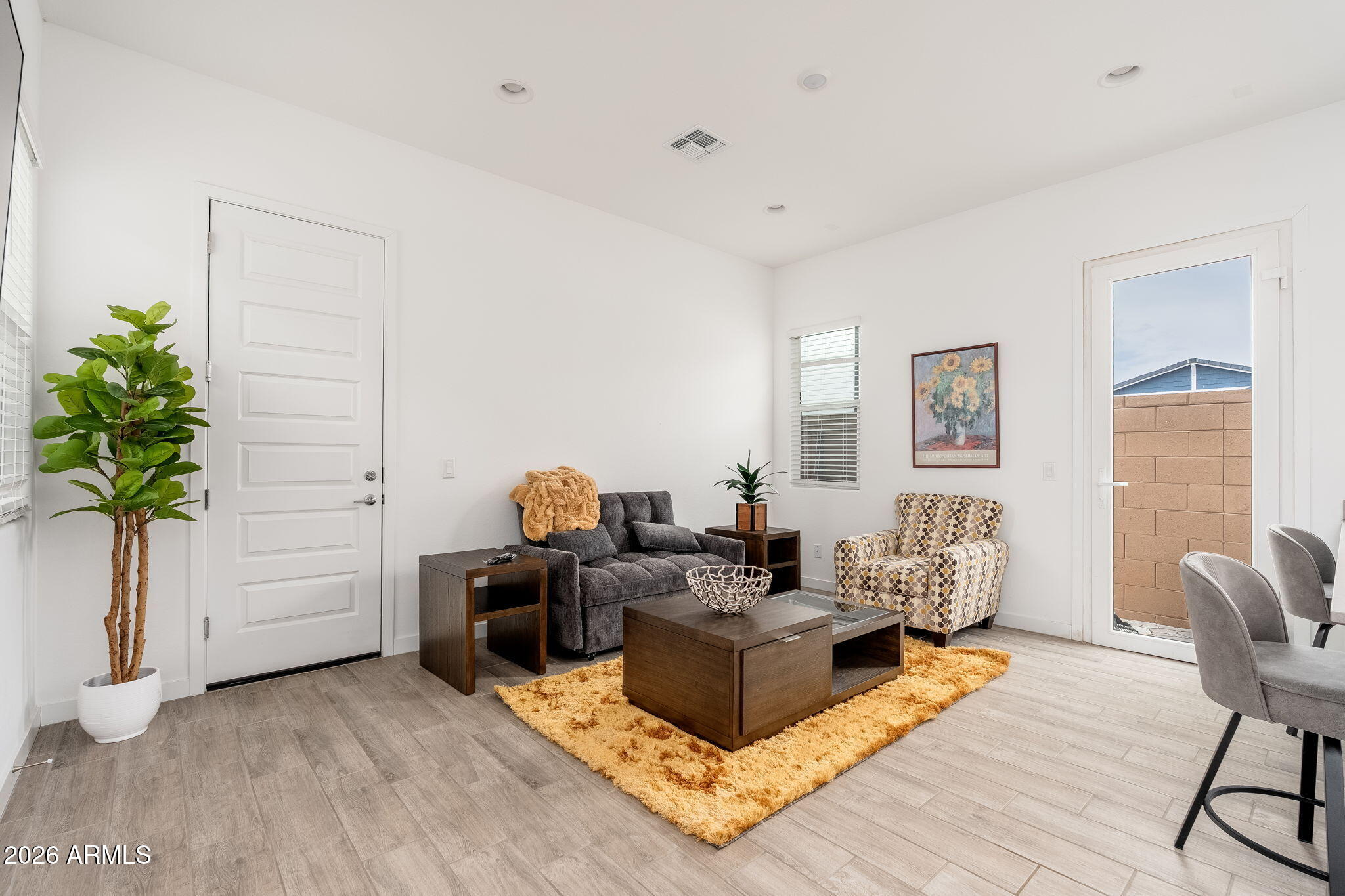 3272 West Peak View Road Phoenix, AZ 85083 - Photo 21 of 47 a living room with furniture and a potted plant